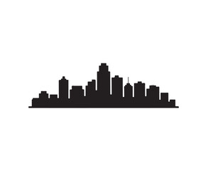 Fototapeta premium A black silhouette of a city skyline with various buildings of different heights and shapes against a stark white background