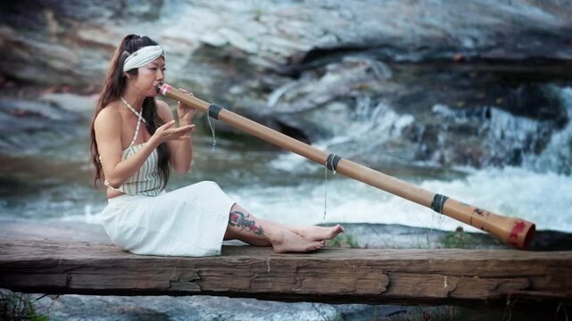 A Tranquil Performance by the Water: Woman Playing a Long Bamboo Instrument didgeridoo in a Scenic Natural Setting, Capturing the Essence of Music and Nature in Harmony