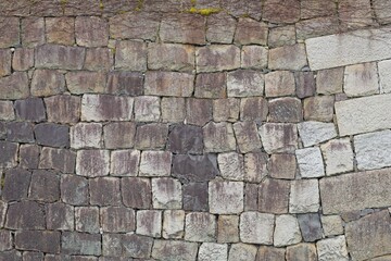 Naklejka premium Weathered stone block wall