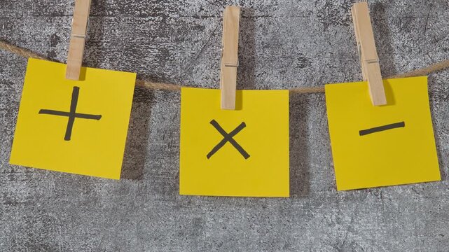Post-it notes plus and minus signs