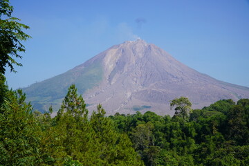 Fototapeta premium A view of Mount Sinabung, a still-active volcano located in Berastagi District, Karo Regency, North Sumatra.