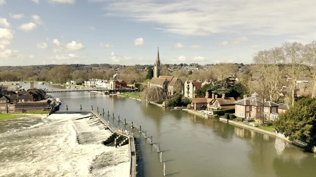 Drone aerial view of Marlow Bridge, River Thames and All Saints Church in Buckinghamshire, England