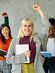 Portrait of a group of young happy business people having fun and celebrating during a meeting in...