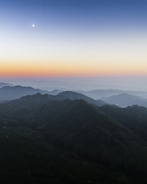 Aerial view of Mount Terminio with its forested peaks under a moonlit sky at twilight Sala, Campania, Italy.