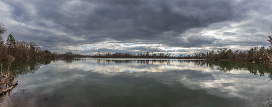 Wide panorama of a lake near Moravska Nova Ves under a cloudy sky