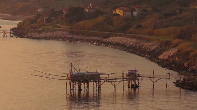 Aerial view of the Trabocchi fishing platforms stand as wooden stilts over the calm waters, a beautiful sight, San Vito Chietino, Abruzzo, Italy.