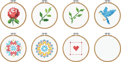 Cross stitch embroidery set with floral rose bird heart and patterns in wooden hoops for hobby and handmade craft design. © MDMUKTADIR