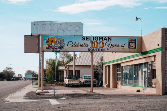 Seligman, Arizona - March 28, 2026: Old Texaco gas station with a 100 year anniversary of Route 66 in 2026 sign