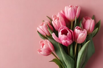 Obraz premium A beautiful bouquet of pink tulips on a soft pink background, capturing the essence of spring and delicate beauty.