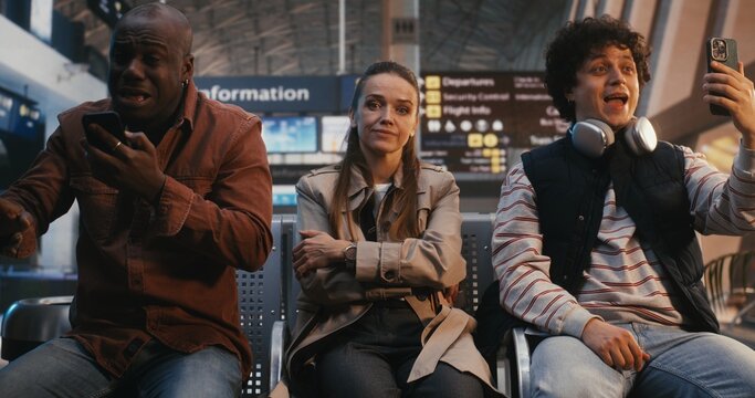 Female Traveler Sits in Airport Area, Displaying Stoic Endurance Despite Clear Discomfort of Crowded Setting. Resilience of Sensitive Individuals Navigating Modern Life Logistical and Social Chaos.