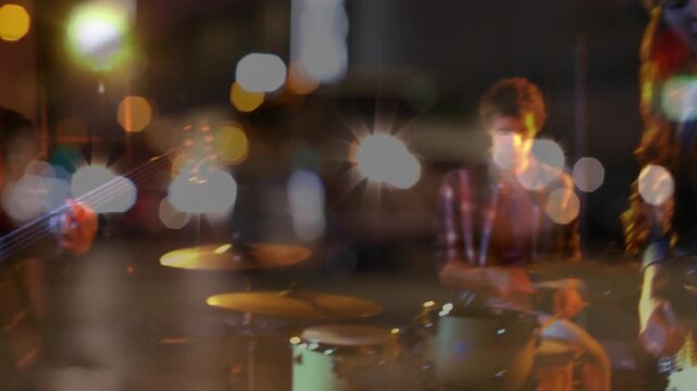 Drummer striking, starting band playing music, camera pulling snare close to singer, bokeh layering