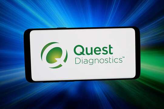 Stuttgart, Germany - 03-20-2026: In this photo illustration, the logo of US laboratory company Quest Diagnostics Inc. is displayed on a smartphone in front of abstract background on computer screen.