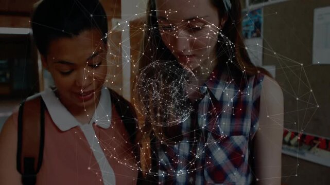 Two schoolgirls pointing passage while studying, causing network globe hologram emerging from book