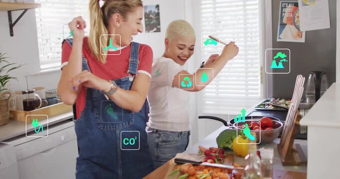 Meal prep sparking two cooks chopping, stirring and dancing while teal icons showing energy metrics