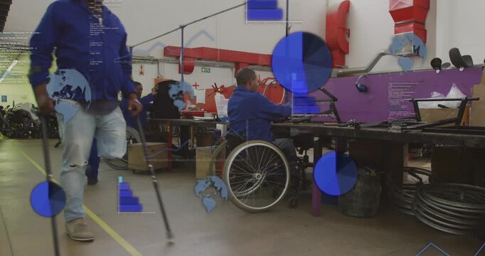 Wheelchair user assembling frame for production, staff walking, blue charts partly obscuring scene