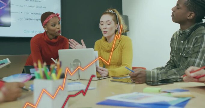 Women presenting in marketing meeting pointing laptop causing moving line charts rising over table
