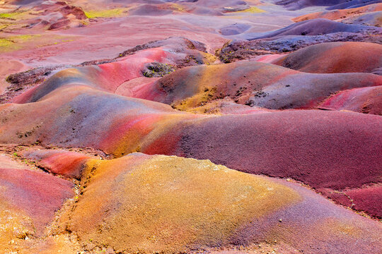 Chamarel Seven Colored Earth Geopark in Mauritius Island. Colorful panoramic landscape about this volcanic geological formation Chamarel Seven Colored Earth Geopark in Riviere noire district.