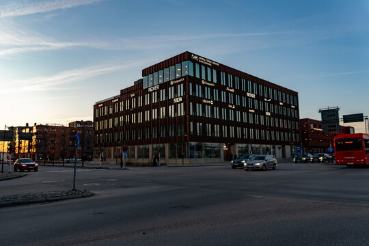 Northern Twilight: Modern Architecture of the World Trade Center Karlskrona Against a Streaking Sunset Sky