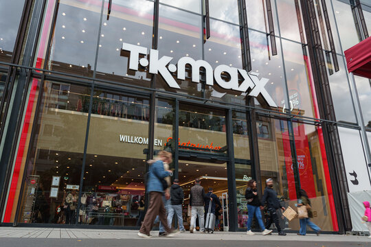 Dusseldorf, Germany - September 11 2025: Shoppers passing by TK Maxx apparel and home goods store in central Dusseldorf