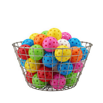 A wire basket overflowing with a vibrant assortment of colorful pickleballs in various shades