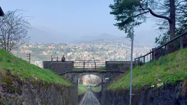 Panoramic view of Lugano city and Lake Lugano from Monte San Salvatore funicular railway, Switzerland, urban and mountain landscape