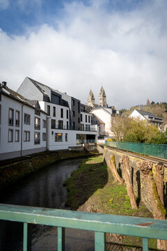 Clervaux town panorama with Clerve river and church bell towers, Luxembourg