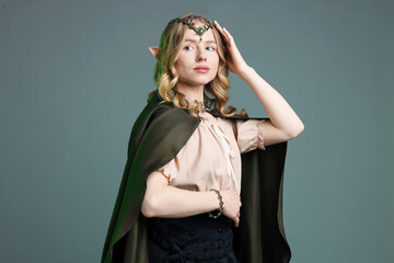 Obraz premium Portrait of beautiful elf girl on grey background
