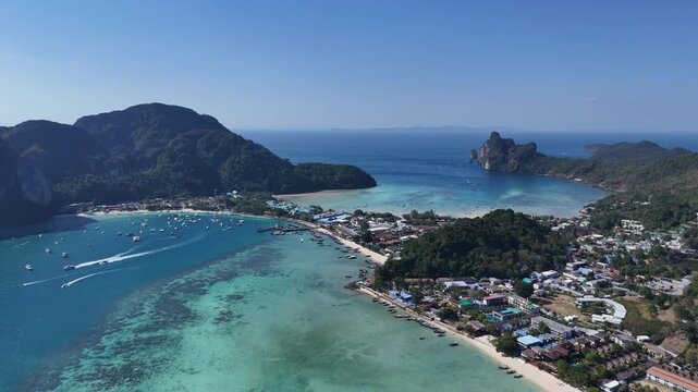 Aerial shot of Phi Phi island showing beaches cliffs and blue sea great for tourism campaigns summer vacation content and luxury travel branding