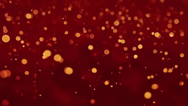 Abstract festive background with glowing golden bokeh particles floating on deep red