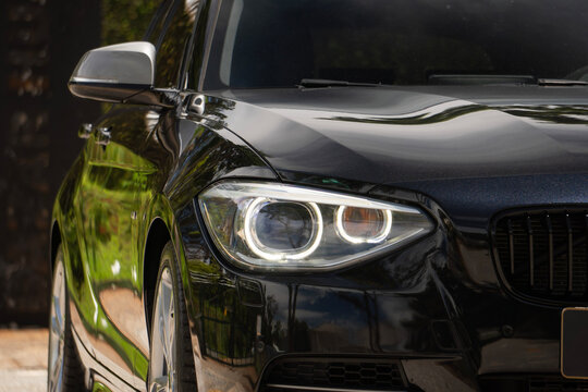 Black BMW M135i headlight focused shotup, Premium compact hot hatch front end details