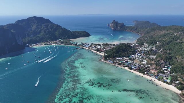 Scenic tropical landscape of Phi Phi island with ocean views and boats filmed from above ideal for vacation marketing relaxation concepts and travel advertising
