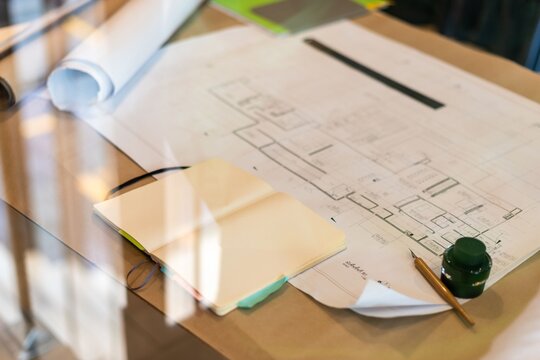 Architectural plans and tools workspace.