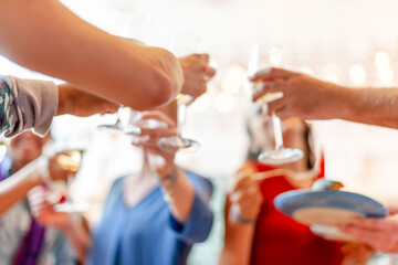 Obraz premium Celebration with raised glasses