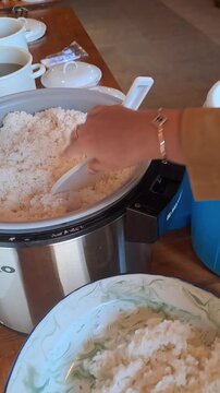 PAMEKASAN, INDONESIA - DECEMBER 15, 2025: Handheld footage inside a traditional Javanese joglo-style restaurant, showcasing authentic Indonesian cuisine, local vegetables, fish dishes, sambal.