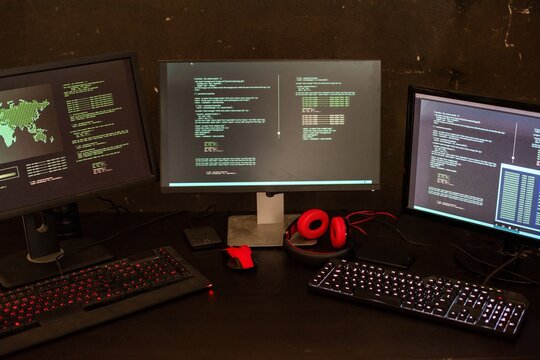 Cybersecurity workstation with coding screens