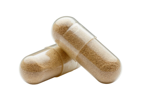 Isolated two clear capsules filled with brown granular powder, dietary supplements or medication