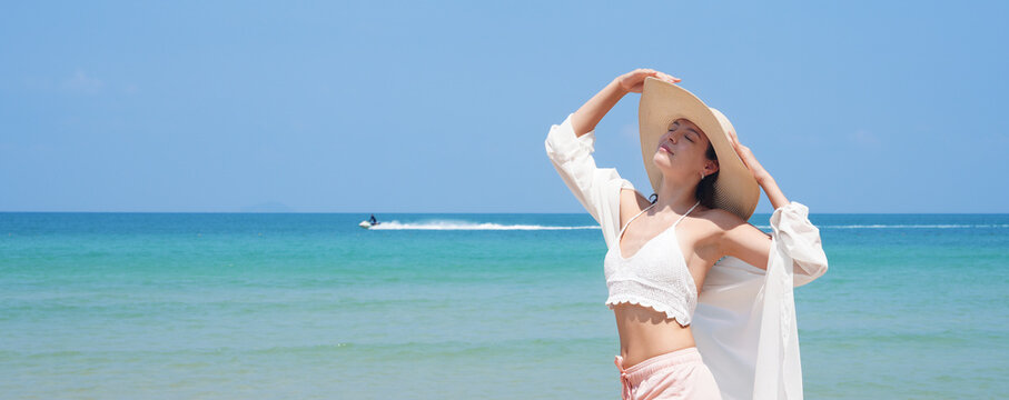 happy young woman on the beach