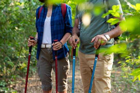 Couple hiking through lush forest