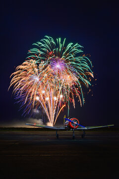 WW2 warbird plane during a fireworks celebration