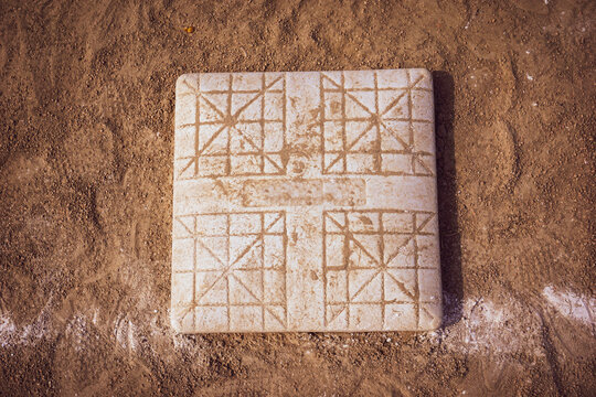 Close-up of base sports equipment on baseball field