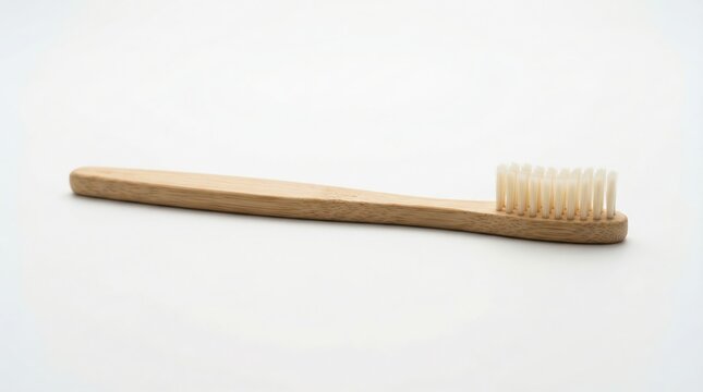 Bamboo toothbrush side view on white background