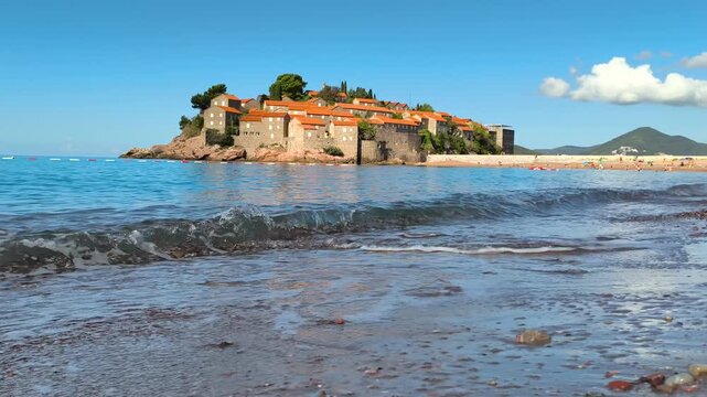 Sveti Stefan beach in montenegro, waves on the beach