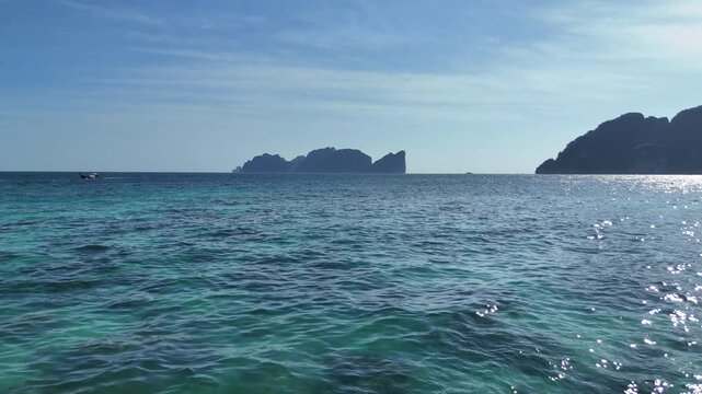 Beautiful aerial flight of Phi Phi island above amazing blue water creating a perfect scene ideal for travel tourism vacation and luxury resort advertising