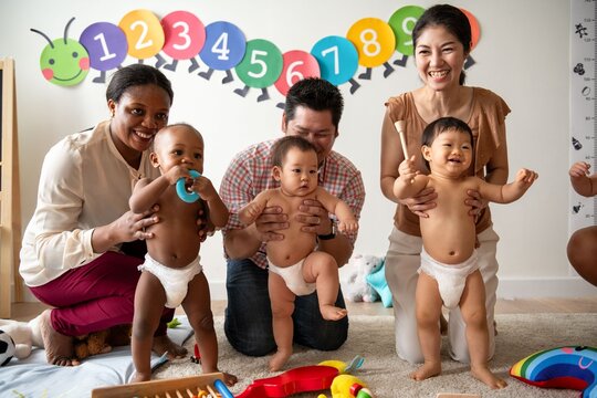 Diverse joyful group with babies