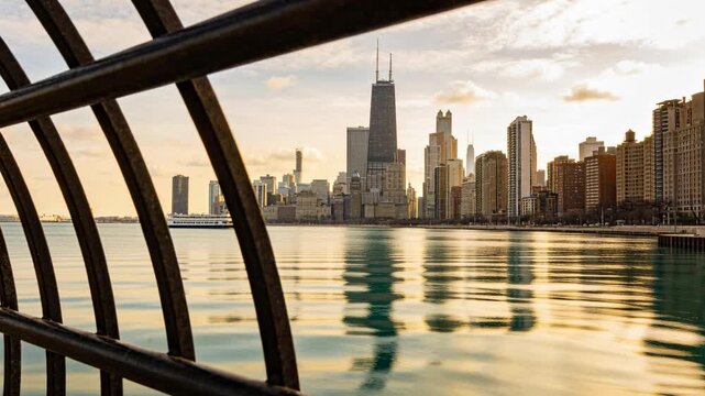 Panning camera moving past metal railing on left, revealing skyline reflections on lake, copy space