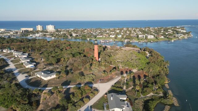Aerial footage of lighthouse at Jupiter, Florida. Luxury Summer family vacation destination.