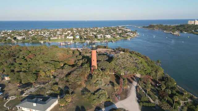 Aerial footage of lighthouse at Jupiter, Florida. Luxury Summer family vacation destination.
