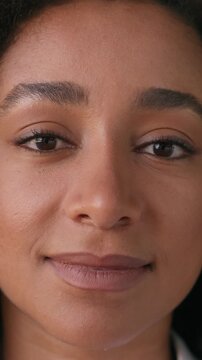 Confident young African American business woman close up face looking camera glad businesswoman female girl entrepreneur blinking staring ethnic lady expression portrait businessperson employee work