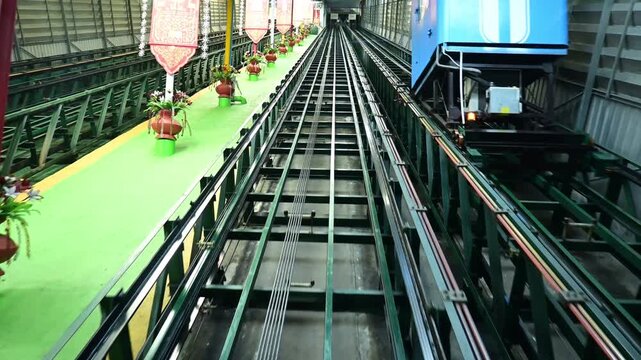 An automated elevator or cable car is used to ascend to Wat Doi Suthep.