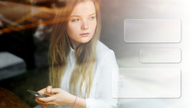 Thoughtful woman holding smartphone photo